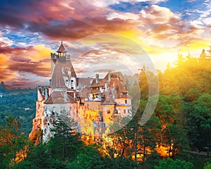 Landscape with medieval Bran castle known for the myth of Dracula at sunset