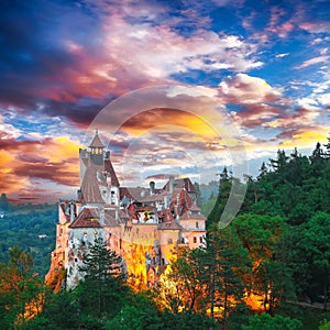 Landscape with medieval Bran castle known for the myth of Dracula at sunset