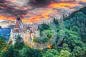 Landscape with medieval Bran castle known for the myth of Dracula at sunset