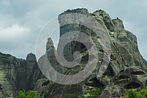 Landscape of Meteora mountains on cloudy sky background.