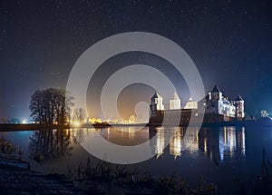 Landscape of Mir Castle in starry night. clear night sky on Mirs