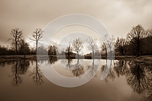 Landscape with misty morning fog in the Forest Lake or Beautiful forest lake in the morning at winter time. Azerbaijan nature.