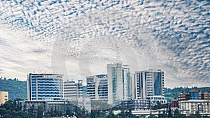 Landscape of modern office buildings under a blue cloudy sky in Kigali, Rwanda