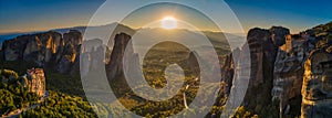 Landscape with monasteries and rock formations in Meteora, Greece. during sunset