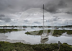 Landscape of moody evening sky over low tide marine