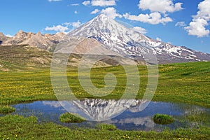 Landscape of Mount Damavand mirrored in mountain pond
