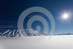 Mount vettore and pian grande with snow photo