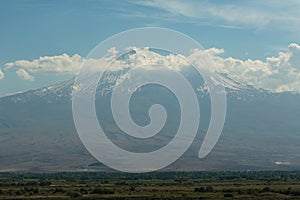 Landscape of mountain ararat enveloped in white clouds