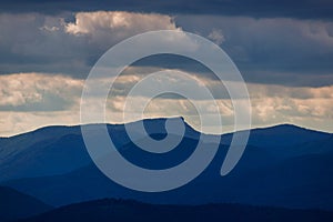 Landscape of mountain ridges with dramatic sky