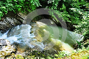 Landscape mountain river with big rocks on the shore