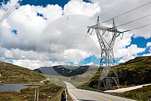 Landscape with mountain road and high voltage reliance line, Norway photo