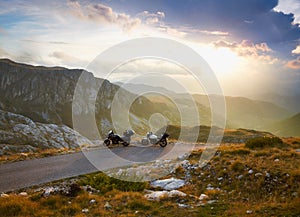 Landscape with mountain road and two motorbikes