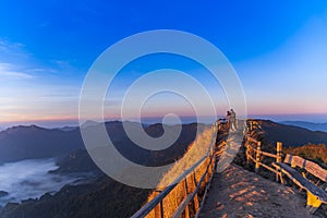 Landscape of the mountain and sea of mist in winter sunrise view from top of Phu Chi Dao mountain , Chiang Rai,