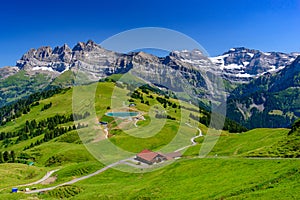 Landscape of mountains of Alps in summer with green meadow in Portes du Soleil, Switzerland