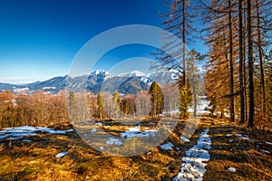 Landscape with mountains in the background at the end of winter