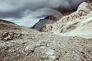 landscape with mountains, clouds and rocks photo