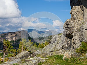 Landscape in the mountains of Ergaki Natural Park. Stones and young cedars