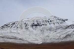 Landscape of mountains in the high lands of Chile near the border with Bolivia. Snow-covered landscapes of the Andes and the