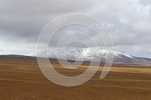 Landscape of mountains in the high lands of Chile near the border with Bolivia. Snow-covered landscapes of the Andes and the