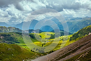 landscape with mountains, hills, clouds and trees photo