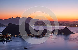 The landscape and mountains of Rio de Janeiro during the sunset in the summer, seen from Niterói city, Brazil.