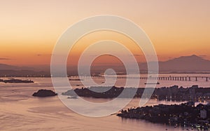 The landscape and mountains of Rio de Janeiro during the sunset in the summer, seen from Niterói city, Brazil.