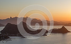 The landscape and mountains of Rio de Janeiro during the sunset in the summer, seen from Niterói city, Brazil.