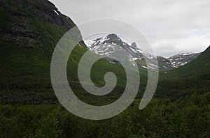 Landscape of mountains with snow on Trollstigen road Norway