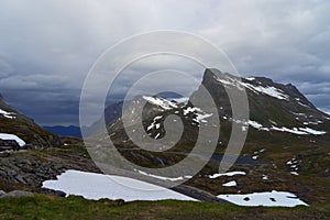 Landscape of mountains with snow on Trollstigen road Norway