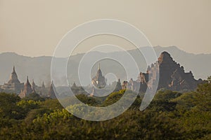 A landscape of mountains, temples and pagodas, immersed in the haze, Myanmar