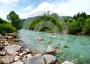 Landscape with mountains trees and rapids of river Salza in front