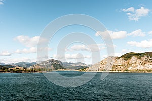 Landscape of the mountains and the water of the Porma reservoir in Castilla y Leon in Spain.The photo has a blue sky with some photo