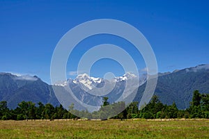 Landscape with Mt. Cook and Mt. Tasman in a blue sky - late summer