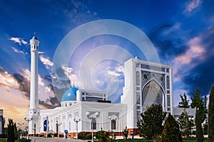 landscape with new modern white Islamic Masjid Minor Mosque in Tashkent in Uzbekistan in summer