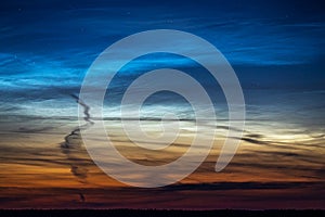 Landscape of night shining noctilucent clouds in the night sky