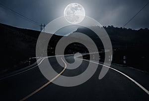 Landscape of nighttime with curvy roadway in forest at national