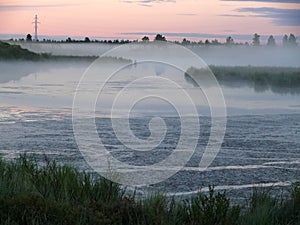 The landscape of the Northern nature. Fog over the river Nadym.