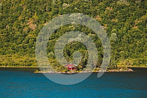 Landscape in Norway red house on island introvert style traditional scandinavian architecture forest and fjord landscape in Norway