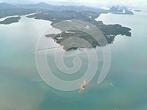 Landscape ocean sea and Island with hill mountains. Top view while flying to Phuket Island, Thailand.