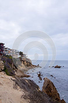 Landscape of the ocean in a secluded cove next to a rockly hillside