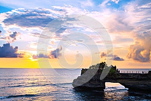 Landscape, Ocean in sunset with cliff and natural arch at Tanah lot, Bali
