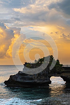 Landscape, Ocean in sunset with cliff and natural arch at Tanah lot, Bali