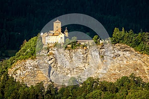 Landscape with old castle in sunset light, Switzerland. Scene of Swiss Alpine terrain