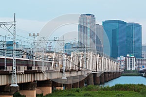 Landscape of osaka city at Umeda from across the Yodogawa River photo