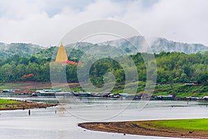 Landscape of pagoda Buddhakhaya in Wat Wang Wiwekaram is a symbol of Sangkhlaburi, Kanchanaburi, Thailand photo