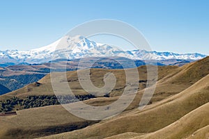 Landscape panorama Elbrus mountain with autumn hills