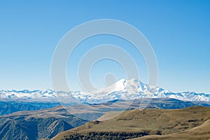 Landscape panorama Elbrus mountain with autumn hills