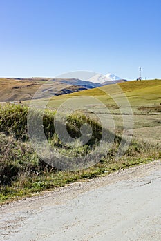 Landscape panorama Elbrus mountain with autumn hills