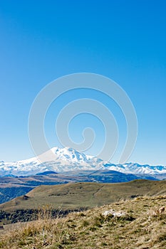 Landscape panorama Elbrus mountain with autumn hills