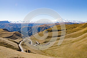 Landscape panorama Elbrus mountain with autumn hills